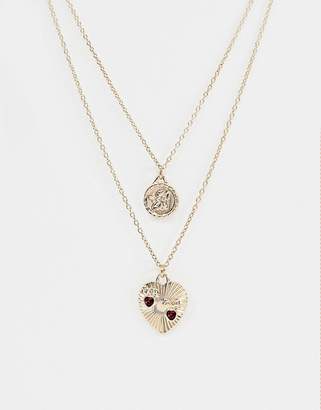 ASOS Design DESIGN multirow necklace with vintage style cupid and engraved heart pendants in gold