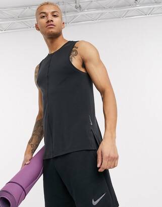 Nike Training Nike Yoga Dri-FIT tank top in black - ShopStyle Shirts