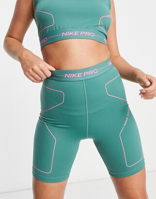 pink and green nike shorts