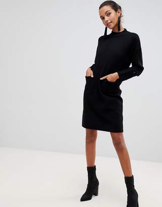 Liquorish long jumper dress with front pockets and lacing detail on sleeves