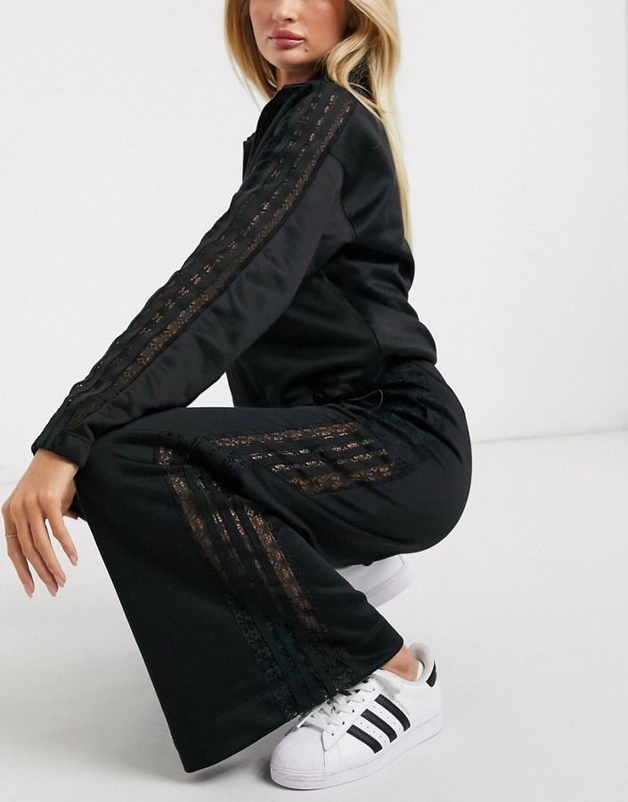 adidas Bellista lace insert wide leg pants in black - ShopStyle