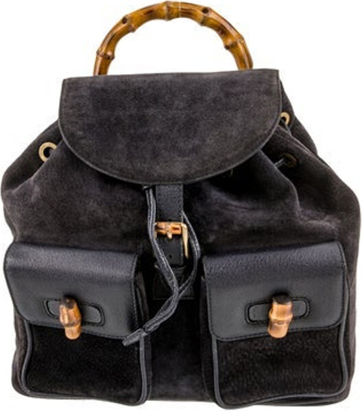 Gucci Backpack Vintage Blue Suede Bamboo Accent Gold-Tone Hardware Bamboo & Leather Trim Bamboo Handle & Dual Adjustable Shoulder Straps Dual Exterior Pockets Jacquard Lining & Single Interior Pocket Drawstring & Buckle Closures at Front
