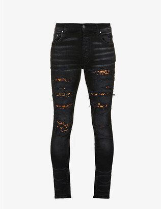 Amiri Leopard print-panel fitted stretch-denim jeans