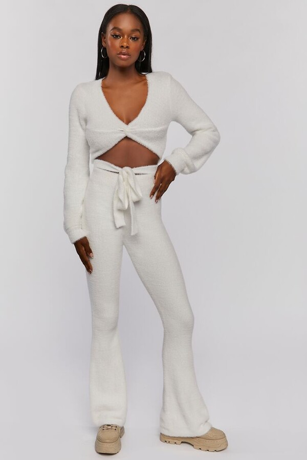 https://img.shopstyle-cdn.com/sim/88/43/884394b891a8c46ccc0ae2657d10cf19_best/womens-fuzzy-flare-pants-in-white-large.jpg