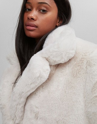 Bershka long faux fur coat in ecru - ShopStyle