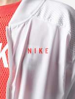 Thumbnail for your product : Nike logo printed mesh panel cropped jacket