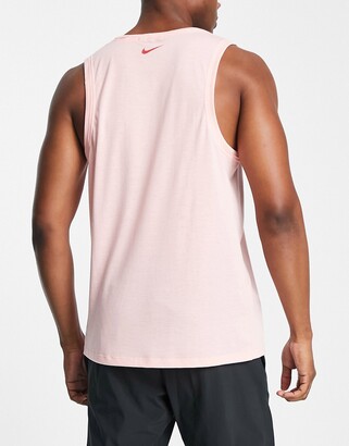 Nike Training Nike Yoga Dri-FIT Layered t-shirt in pink - ShopStyle Tops