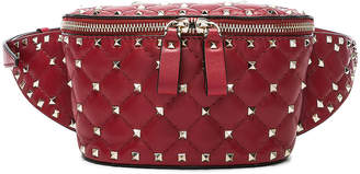 Valentino Small Quilted Rockstud Spike Belt Bag in Red | FWRD