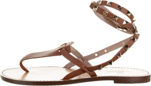 Valentino Leather Gladiator Sandals Brown Studded Accents Wrap-Around Straps & Buckle Closure at Ankles Includes Box & Dust Bag Unfortunately due to restrictions this item may not be eligible for shipping in all areas.