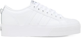 white platform leather trainers