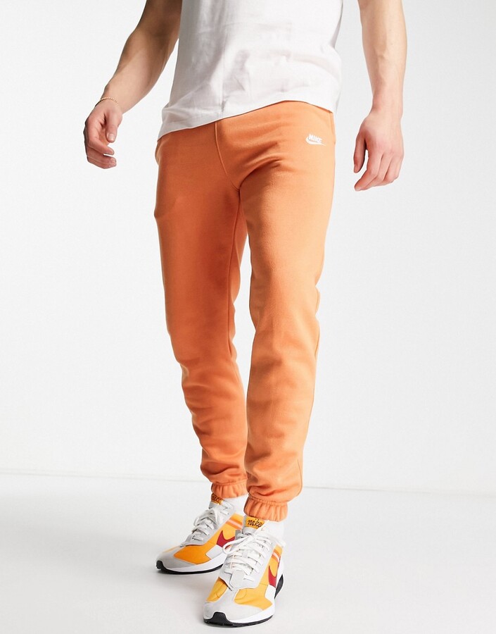 Nike Club Fleece casual fit cuffed sweatpants in dusty orange - PEACH -  ShopStyle Activewear Pants