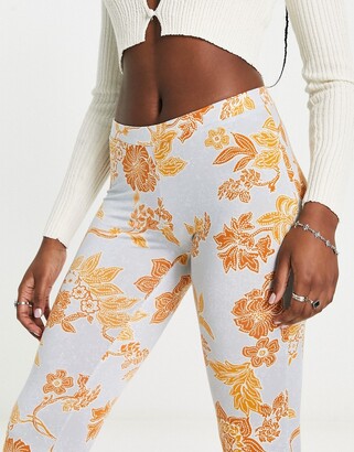 Free People bloom floral slinky flared pants in light blue - ShopStyle
