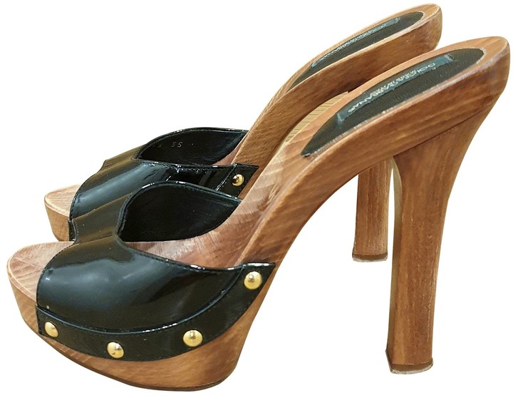 black patent leather mules