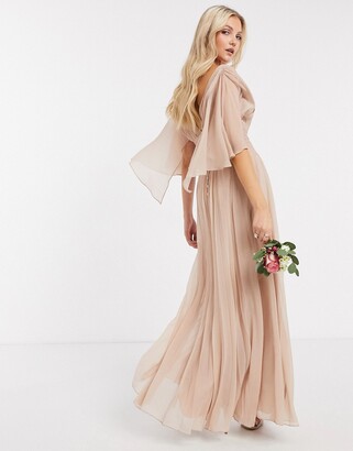 https://img.shopstyle-cdn.com/sim/8b/a1/8ba1e2f108fdd8852f00d339b11e7661_xlarge/asos-design-bridesmaid-ruched-bodice-drape-maxi-dress-with-wrap-waist-and-flutter-cape-sleeve-in-blush.jpg