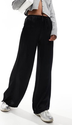 Bershka tie waist wide leg satin trousers in black - ShopStyle