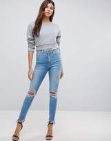 Thumbnail for your product : ASOS DESIGN Ridley high waist skinny jeans in mottled light stone wash with busts
