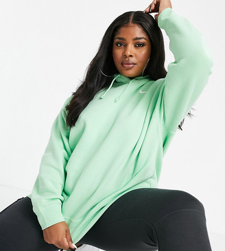 Nike Plus mini swoosh oversized hoodie with tuck sleeve detail in green -  ShopStyle Activewear Tops