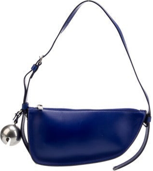 Burberry Shoulder Bag By Daniel Lee Blue Leather Silver-Tone Hardware Single Shoulder Strap Leather Lining Zip Closure at Top Includes Dust Bag Unfortunately, due to restrictions, this item may not be eligible for shipping in all areas.
