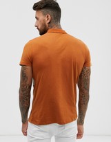 Thumbnail for your product : ASOS DESIGN polo shirt with contrast body panel in brown