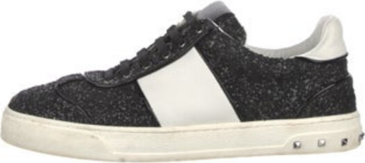 Valentino Glitter Low Top Sneakers Black & White Colorblock Pattern Rockstud Accents Rubber Trim Round-Toes with Glitter Accents Lace-Up Closure at Uppers Includes Box