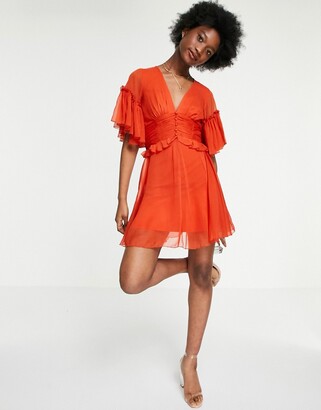 ASOS DESIGN flutter sleeve midi dress with pleated waist and button detail in rust
