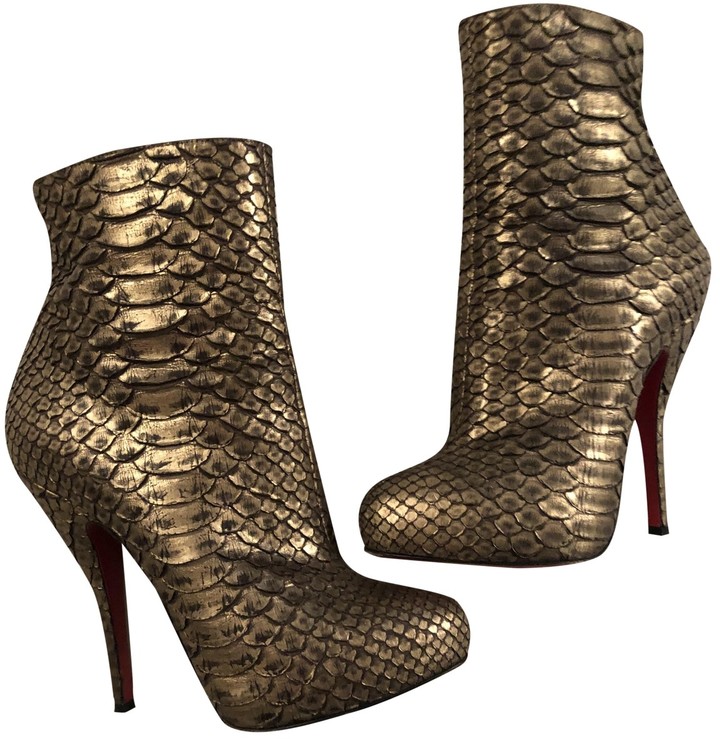 Christian Louboutin Gold Python Ankle boots - ShopStyle