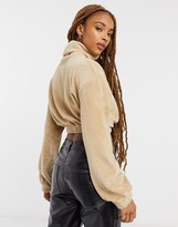 Thumbnail for your product : Bershka velvet ribbed roll neck cropped jumper in beige