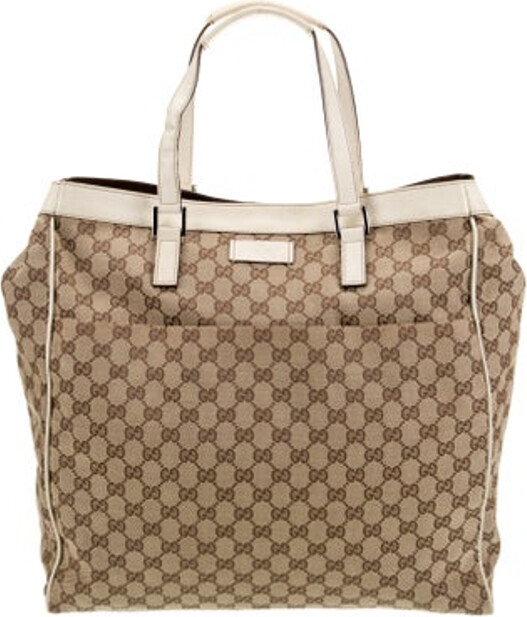 Gucci Tote Neutrals Canvas GG Canvas Silver-Tone Hardware Leather Trim Dual Shoulder Straps Leather Trim Embellishment & Single Exterior Pocket Canvas Lining & Dual Interior Pockets Snap Closure at Top Protective Feet at Base Includes Dust Bag