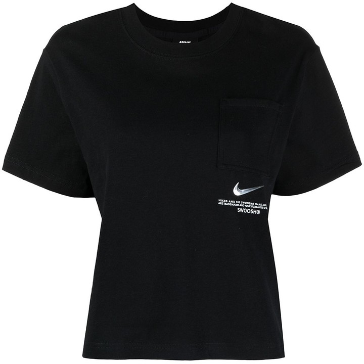 white and pink nike shirt