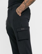 Thumbnail for your product : Mauvais cargo trousers with chain in black pinstripe