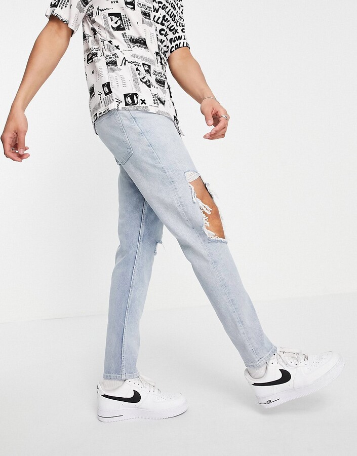 ASOS DESIGN slim jeans with knee rips in vintage light wash blue - ShopStyle