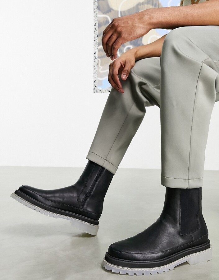 ASOS DESIGN chelsea calf boots in black faux leather with translucent chunky  sole - ShopStyle