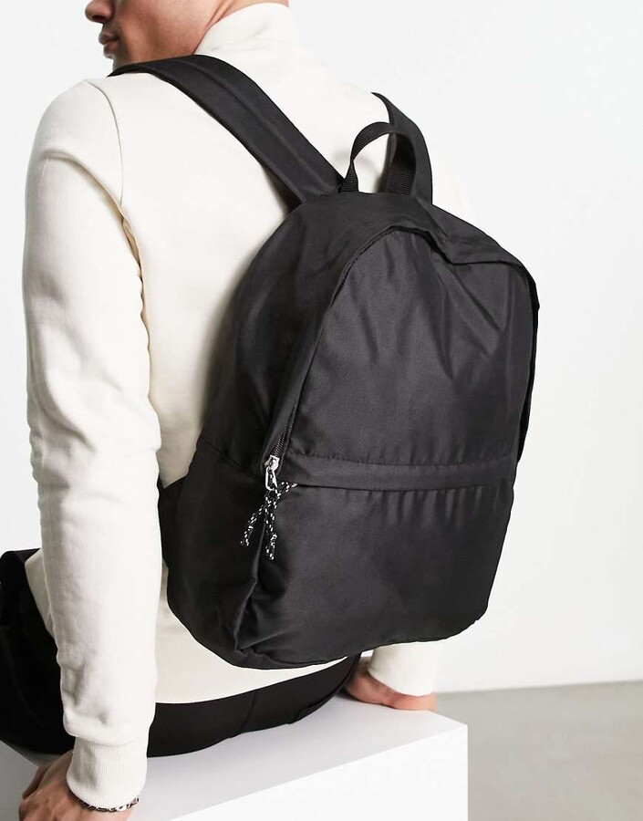 ASOS DESIGN backpack in black nylon with contrast puller ShopStyle
