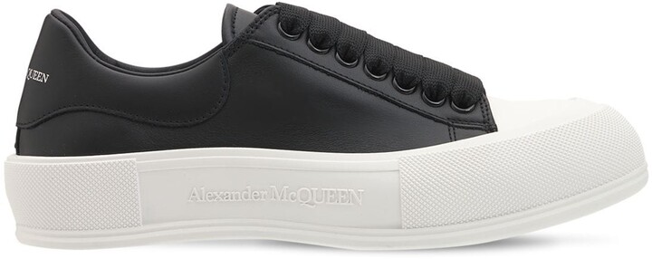 black leather plimsolls