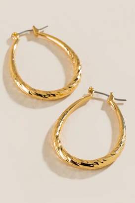 francesca's Maevyn Diamond Cut Oval Hoops Earrings - Gold