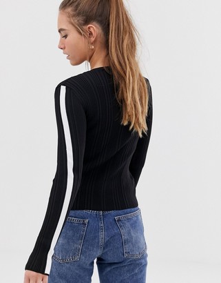Bershka long sleeve side stripe knitted top in black