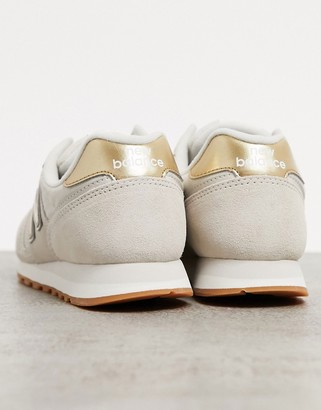 New Balance 373 sneakers in cream and gold - ShopStyle