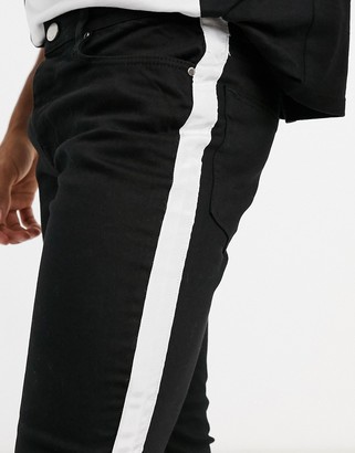 Criminal Damage skinny fit jeans with side tape detail in black