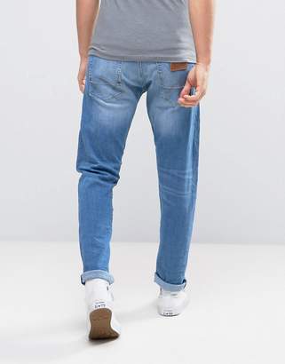 Wrangler Tapered Fit Jeans In Cocktail Time Blue