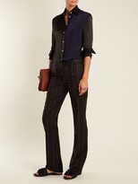 Thumbnail for your product : Wales Bonner Beuys Pinstriped Slim-leg Wool Trousers - Black