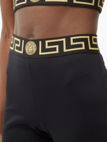Thumbnail for your product : Versace Logo-intarsia Tech-jersey Flared Leggings - Black