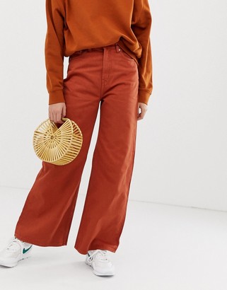 Weekday Ace organic cotton wide leg jeans in rust