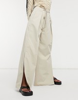 Thumbnail for your product : GHOSPELL pleated wide leg paperbag waist trousers with slits in beige