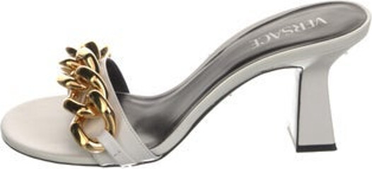 Versace Leather Slides Black Chain-Link Accents Includes Box & Dust Bag Unfortunately, due to restrictions, this item may not be eligible for shipping in all areas.