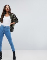 Thumbnail for your product : ASOS DESIGN Petite Ridley ankle grazer jeans in lightwash blue