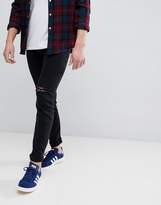 Thumbnail for your product : ASOS Design DESIGN skinny jeans in black with knee rips