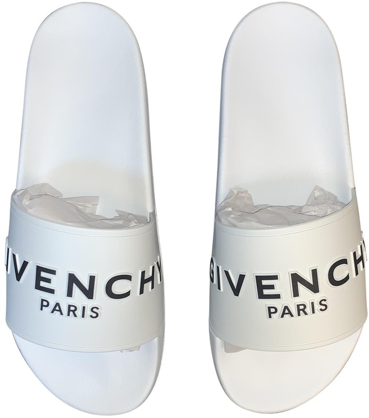 white plastic sandals