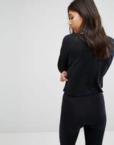 Thumbnail for your product : Nike Logo Cropped Long Sleeve Top