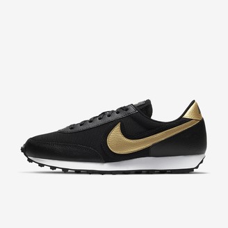 gold black nike shoes