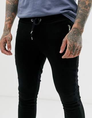 ASOS Design DESIGN super skinny joggers in black with silver zip pockets